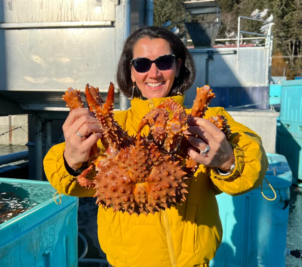 Mary Peltola holding a king crab.