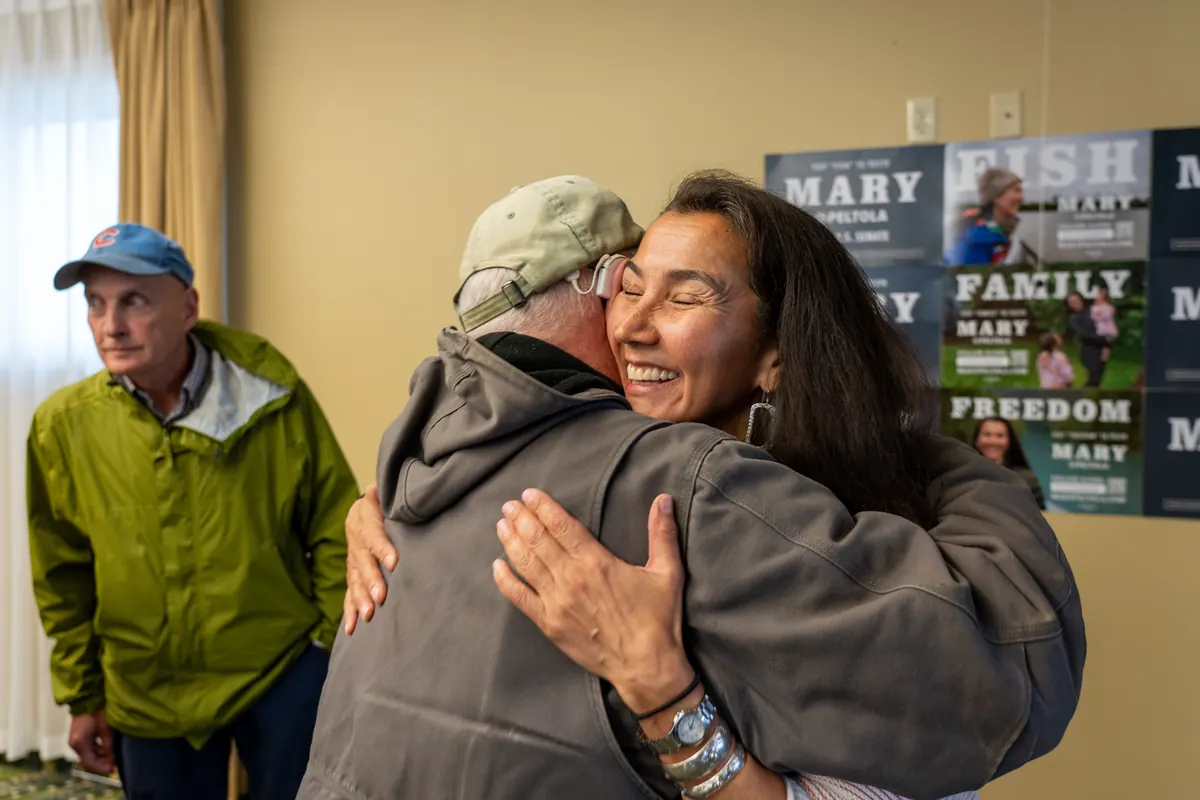 Mary Peltola hugs a supporter at a campaign stop.