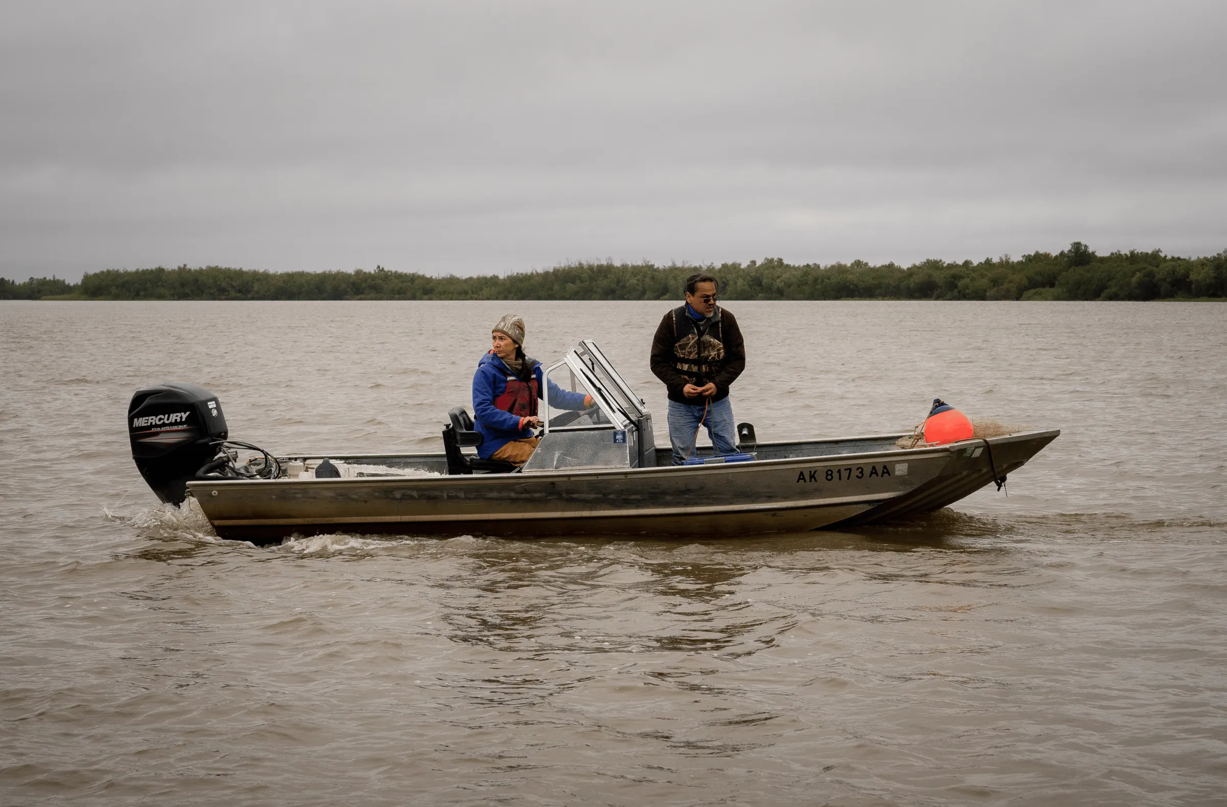 Mary Peltola and a fisherman run a skiff across the Kuskokwim River.