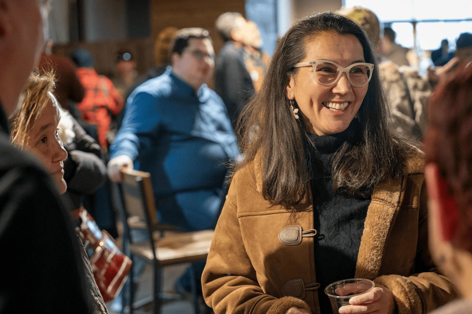 Mary Peltola smiling with supporters at 49th State Brewing in Anchorage.