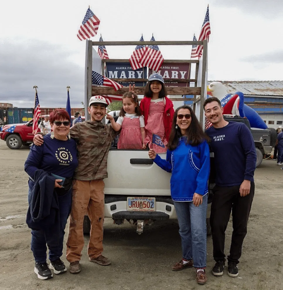 Mary Peltola and supporters by a Mary float at Bethel’s Independence Day parade.