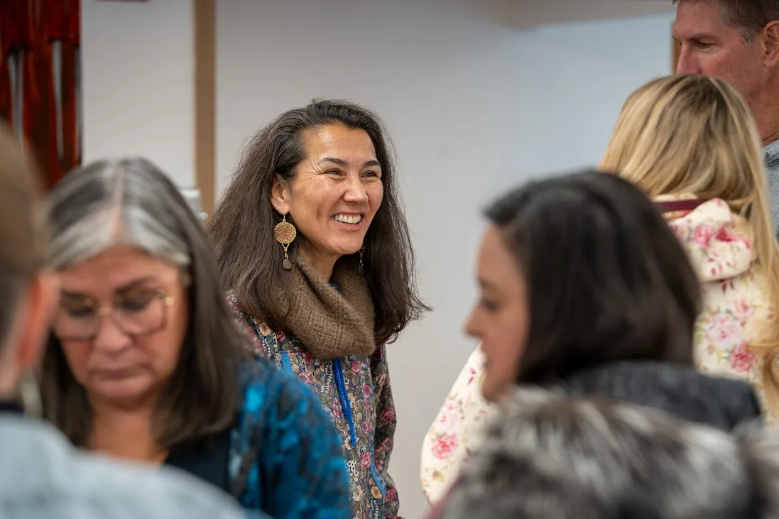 Mary Peltola smiling among Alaskans at the meet and greet in Naknek.