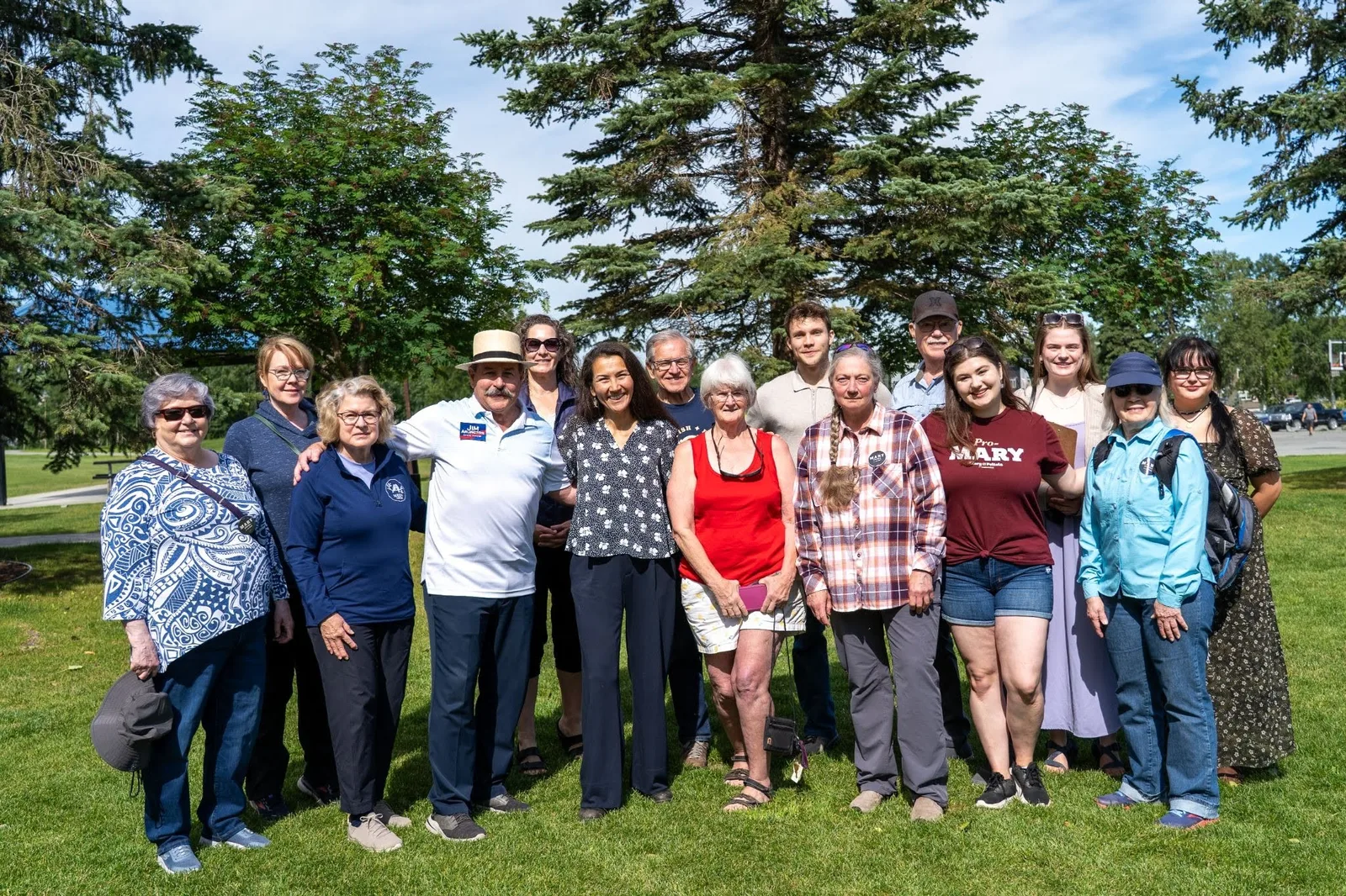 Mary Peltola with volunteers on a lawn at the Eagle River canvass launch.